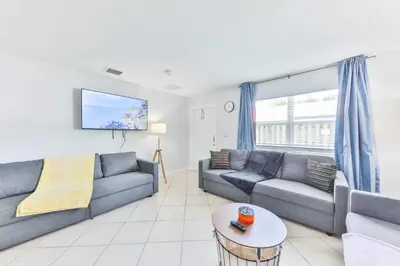 a living room with two couches and a tv at Fantastic Family Nest for Joy STR-2310#1 in Fort Lauderdale