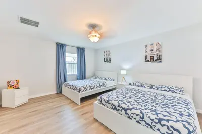 a bedroom with two beds and a window at Fort Lauderdale Family Bestseller in Fort Lauderdale