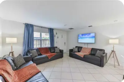 a living room with two couches and a flat screen tv at Fort Lauderdale Family Bestseller in Fort Lauderdale