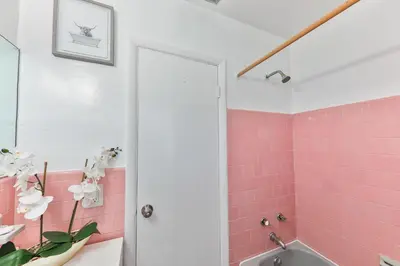 a pink bathroom with a tub and a sink at Lucky Family Charm STR-2750 in Hollywood