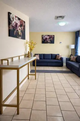 a living room with a table and a couch at Lucky Family Charm STR-2750 in Hollywood