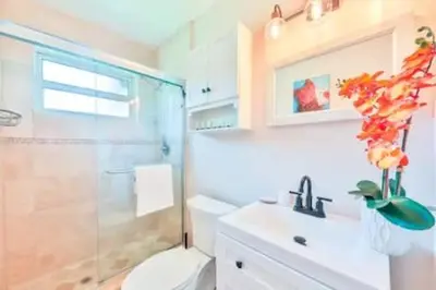 a bathroom with a shower and a toilet and a sink at Cruise Family house STR-1761 in Fort Lauderdale
