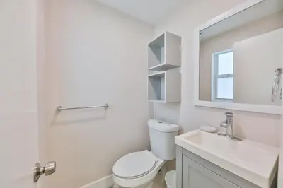 a white bathroom with a toilet and a sink at Jungle Happiness Villa STR-2651 in Hollywood