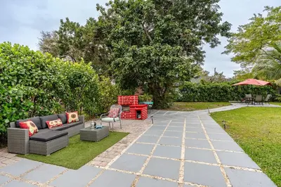 a patio with a couch and chairs in a yard at Sunset Villa- 3 Bedroom 2 Bathroom -6 Beds in Miami