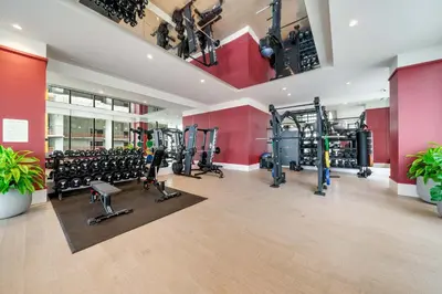 a gym with lots of treadmills and machines at Urban Oasis Luxury Suite- Sky High Amenities in Miami