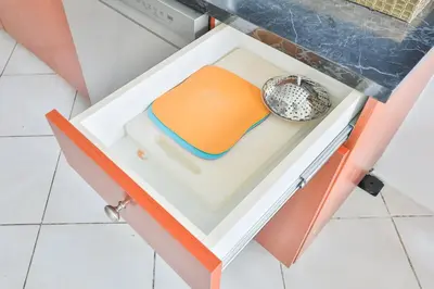 a drawer with an orange lid and a bowl in it at Friday Family Feels Only in Hollywood