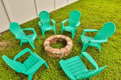 a group of lawn chairs around a fire pit at Friday Family Feels Only in Hollywood