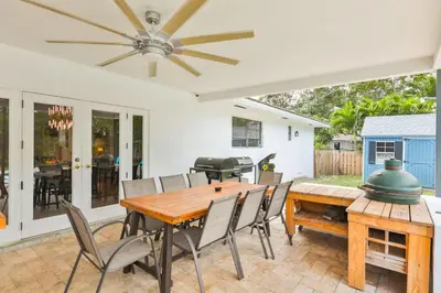 a dining room with a table and chairs at A star is born villa in Hallandale Beach
