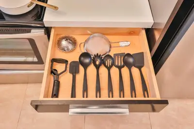 a group of utensils in a wooden drawer at Release your nature in Hallandale Beach