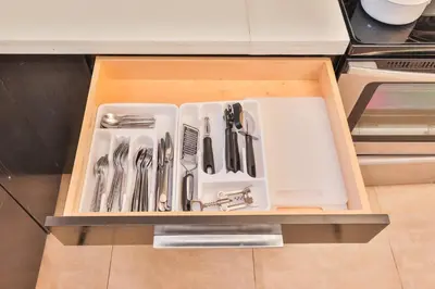 a drawer filled with utensils in a kitchen at Release your nature in Hallandale Beach