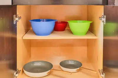 three bowls sitting on shelves in a cabinet at Release your nature in Hallandale Beach