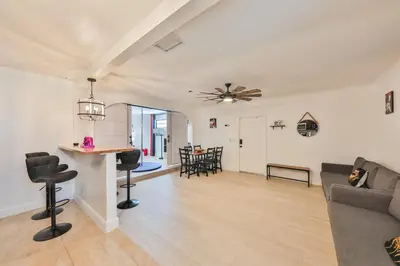 a living room with a couch and a table at Release your nature in Hallandale Beach