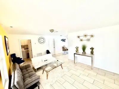 a living room with a couch and a table at Better Experience Property in Miramar