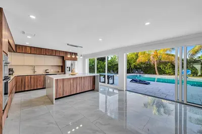 an open kitchen with a pool and a swimming pool at Casa Sol in Richmond Heights