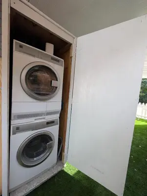 a washer and dryer inside of a house at PrimeStay Modern Studio in Prime Location in Hollywood