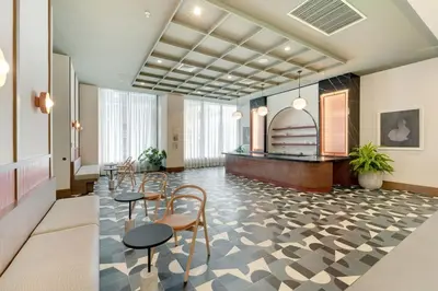 a lobby with chairs and a table in a building at Crosby Miami WTC 2BR 2BA High Floor Corner #3101 in Miami