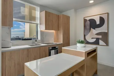 a kitchen with a white counter and a window at Crosby Miami WTC 2BR 2BA High Floor Corner #3101 in Miami