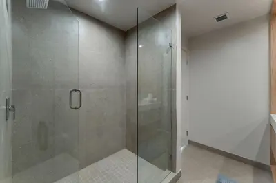 a shower with a glass door in a bathroom at Crosby Miami WTC 2BR 2BA High Floor Corner #3101 in Miami