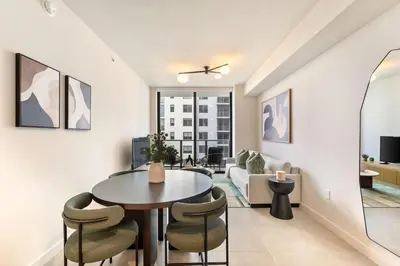a living room with a table and chairs and a couch at Crosby Miami WTC 1BR 1BA Chic Flawless New #2913 in Miami