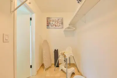a white room with a staircase and a stair case at Hollywood Tropical Paradise vibe waterfall pool villa in Hollywood