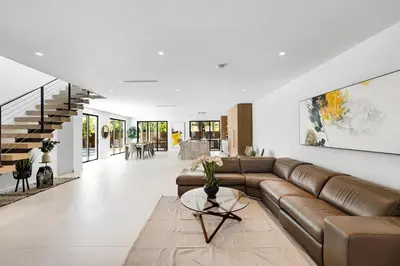 a living room with a couch and a table at Up to 10 Guests! Design District Villa in Miami