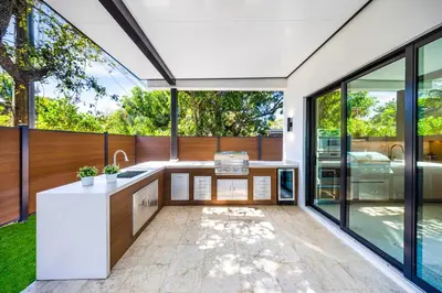 an open kitchen with a view of a house at Up to 10 Guests! Design District Villa in Miami