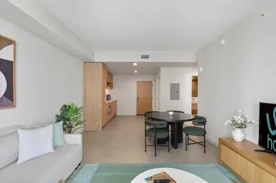 a living room with a couch and a table at Luxury Urban Comfort at The Crosby Miami - Central Location in Miami