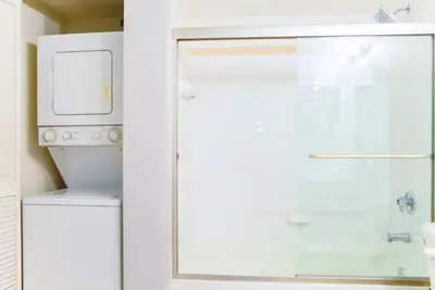 a shower with a glass door in a bathroom at Poolside Brickell Gem Stay in Miami