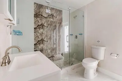 a bathroom with a tub and a toilet and a shower at Villa Shallat in Miami