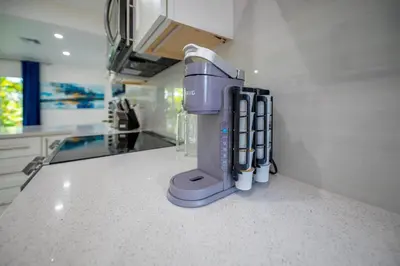 a kitchen counter with a blender on a counter top at Walkable 1BR Apt near Las Olas - Fast WiFi & AC in Fort Lauderdale