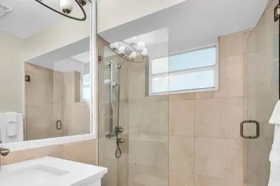 a bathroom with a shower and a sink at Aventura Lakefront in Miami