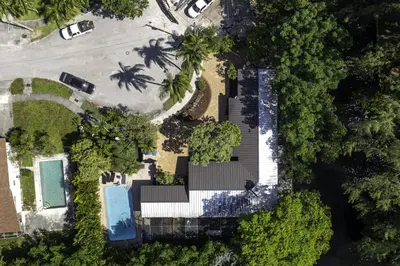 an aerial view of a resort with a swimming pool and trees at Aventura Lakefront in Miami