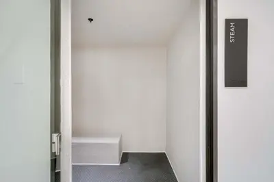 a white room with a stair case in it at City Atelier -Sauna Pool Parking in Miami