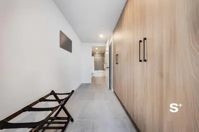 a hallway with a staircase and a wooden wall at Downtown Miami Cozy 1BR with Views in Miami