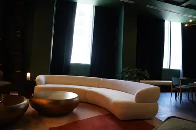a living room with a white couch and a table at Stylish Minimalist 1BR in The Crosby in Miami