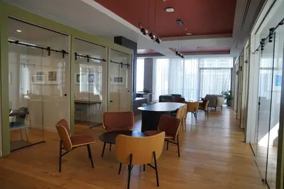 a hallway with chairs and tables in a building at Stylish Minimalist 1BR in The Crosby in Miami