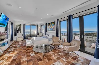 a living room with a view of the ocean at Crown Jewel of Ocean Drive- 2 story Penthouse, 4 Bedrooms & Private rooftop spa in Miami Beach