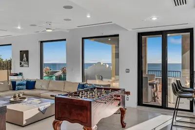 a living room with a couch and a table at Crown Jewel of Ocean Drive- 2 story Penthouse, 4 Bedrooms & Private rooftop spa in Miami Beach