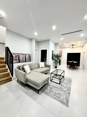 a living room with a couch and a table at Art District Stay Wynwood & Design District Nearby in Miami