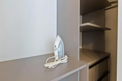 a kitchen counter with a scale on a shelf at Brand new Studio at The Crosby Miami Worldcenter in Miami