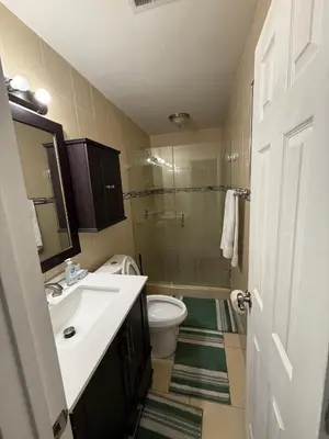 a bathroom with a sink and a toilet and a shower at Better Experience Property in Miramar