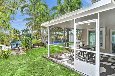 an exterior view of a house with a patio at Waterfront ocean House Hollywood Hard Rock airport in Fort Lauderdale