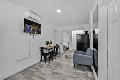 a white living room with a table and chairs at Cozy Studio 2 Blocks from the Beach - Unit #3 in Hollywood