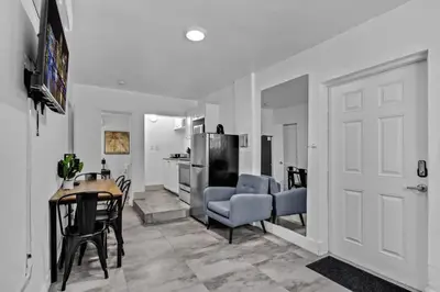a living room with a table and chairs and a door at Cozy Studio 2 Blocks from the Beach - Unit #3 in Hollywood