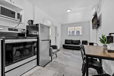 a kitchen and dining room with a table and an oven at Cozy Studio 2 Blocks from the Beach - Unit #3 in Hollywood