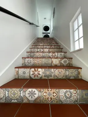 a set of stairs with tiles on them at Spanish Style home in Miami Upper East Side in Miami