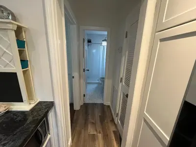 a hallway with a door leading to a bathroom at Beachside One Bedroom Condo with Pool Access in Hollywood