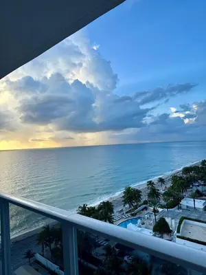 a view of the ocean from the balcony of a resort at Beach Paradise Awaits No Resort Parking Fees in Hollywood