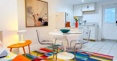 a kitchen with a table and chairs in a kitchen at Take It Easy - Studio Pool Waterfront in Fort Lauderdale