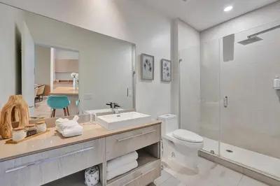 a bathroom with a sink and a toilet and a shower at Beachfront Luxe Condo Sunrise Oceanview Balcony in Hollywood